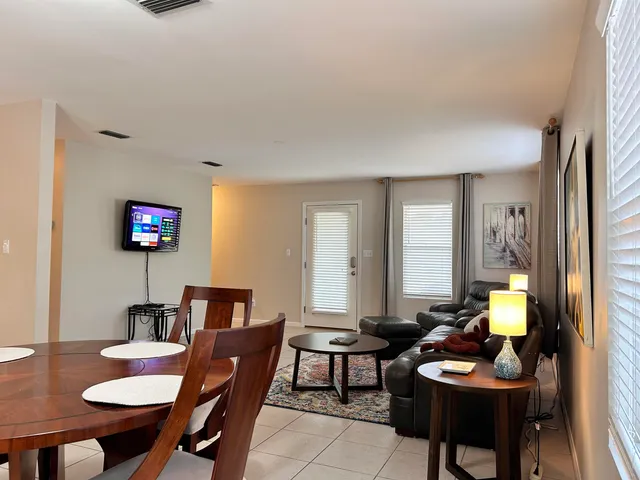 a living room with furniture and a table