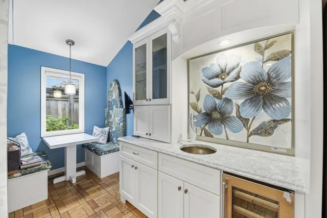 a view of kitchen with window and sink