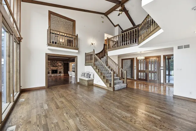 a view of entryway livingroom and hall with wooden floor