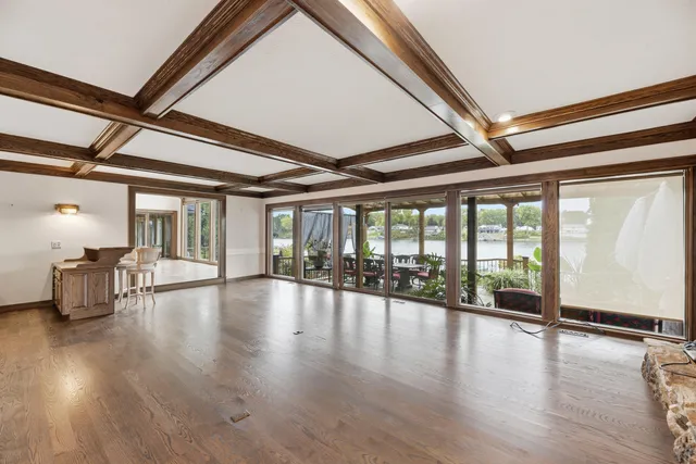 a view of an entryway with wooden floor