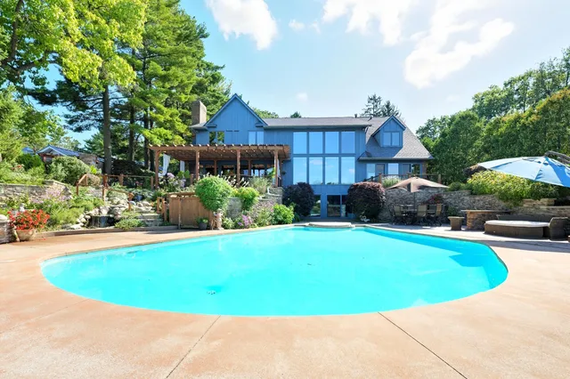 a view of a swimming pool and lounge chair