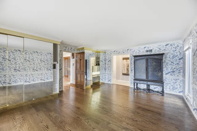 a view of an entryway with wooden floor