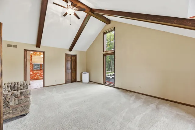 a view of an empty room with windows