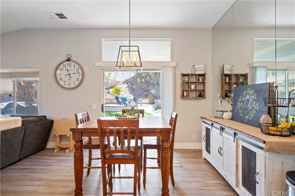 22877 Mountain Ash Circle Corona, CA 92883 - Photo 16 of 41 a view of dining table and chairs