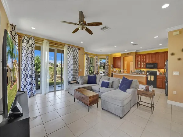 a living room with furniture wooden floor and a table