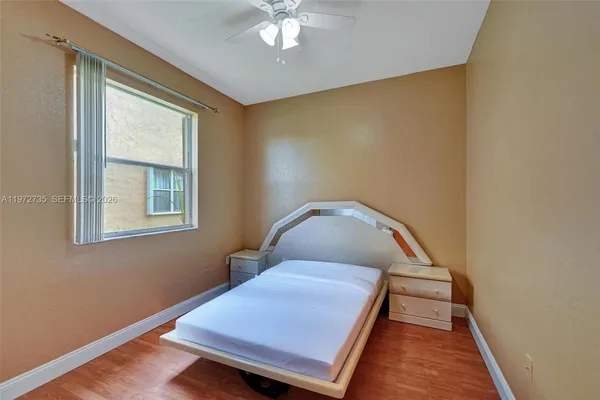 a view of interior space with wooden floor and staircase