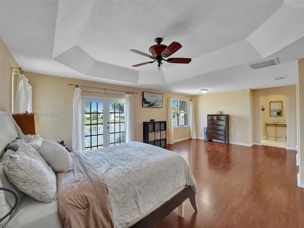a bed room with a bed and a book shelf