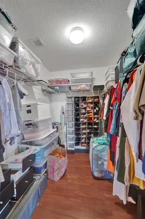a large white kitchen with a large window