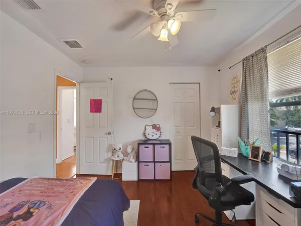 a view of a balcony with wooden fence