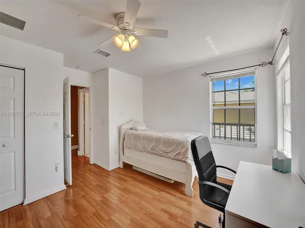 a view of balcony with wooden floor