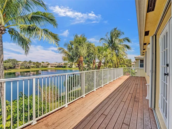 an aerial view of a house with a lake view