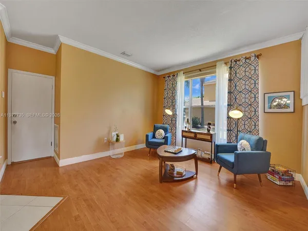 a living room with furniture and a table
