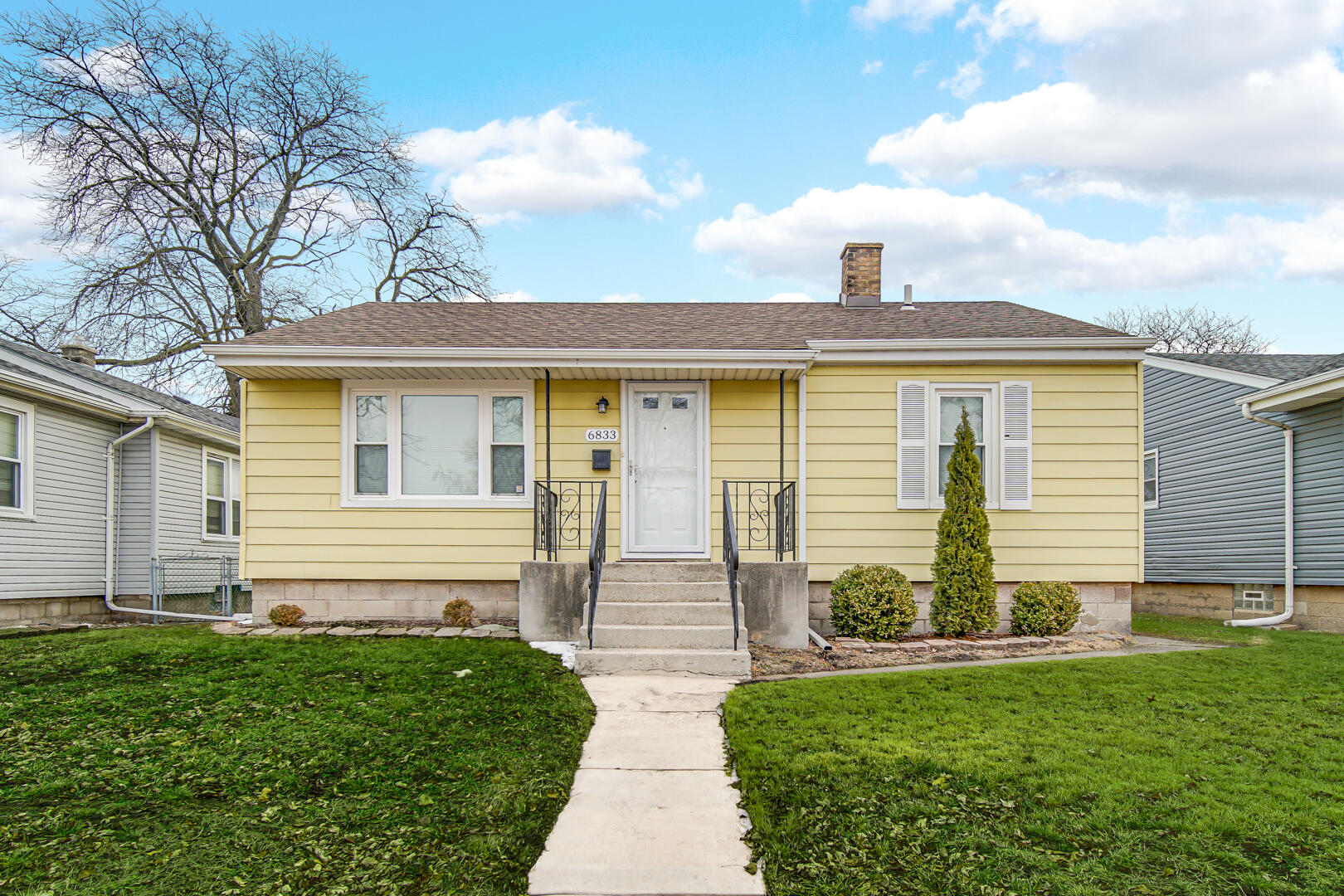 6833 Baring Avenue Hammond, IN 46324 - Photo 1 of 1 a front view of a house with garden