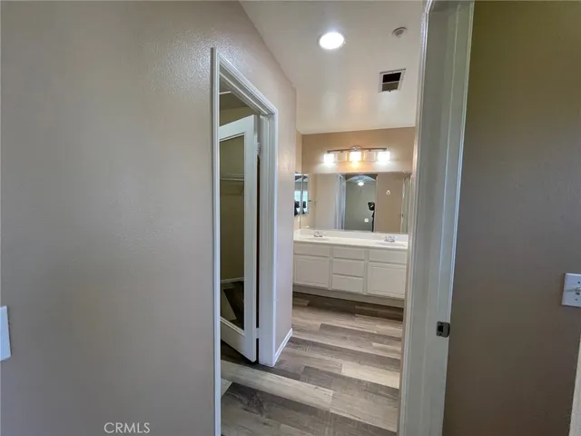 a white toilet sitting in a bathroom next to a sink