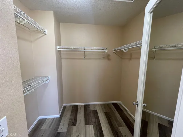 a bathroom with a bathtub and a double vanity sink mirror