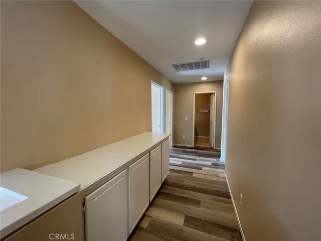a view of workspace with wooden floor and window