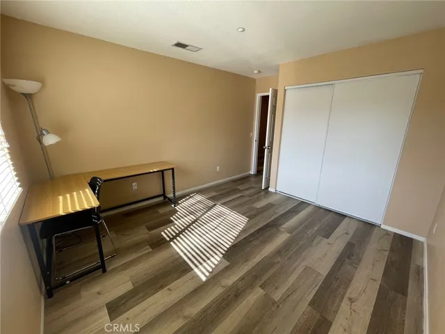 a room with a bed and a window