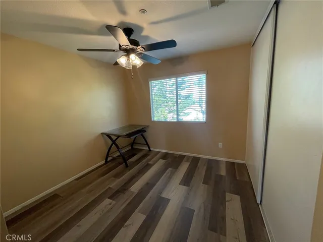 a view of room with a ceiling fan