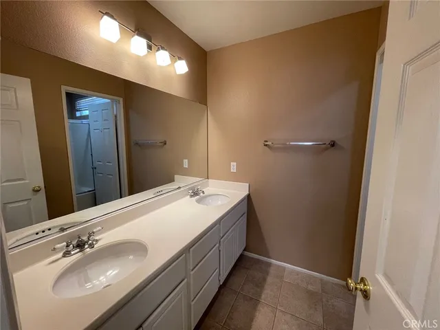 a white toilet sitting next to a bath tub