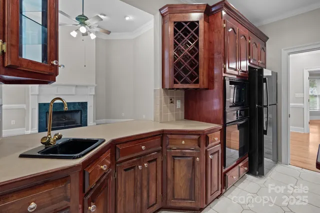 a kitchen with stainless steel appliances a sink stove and cabinets