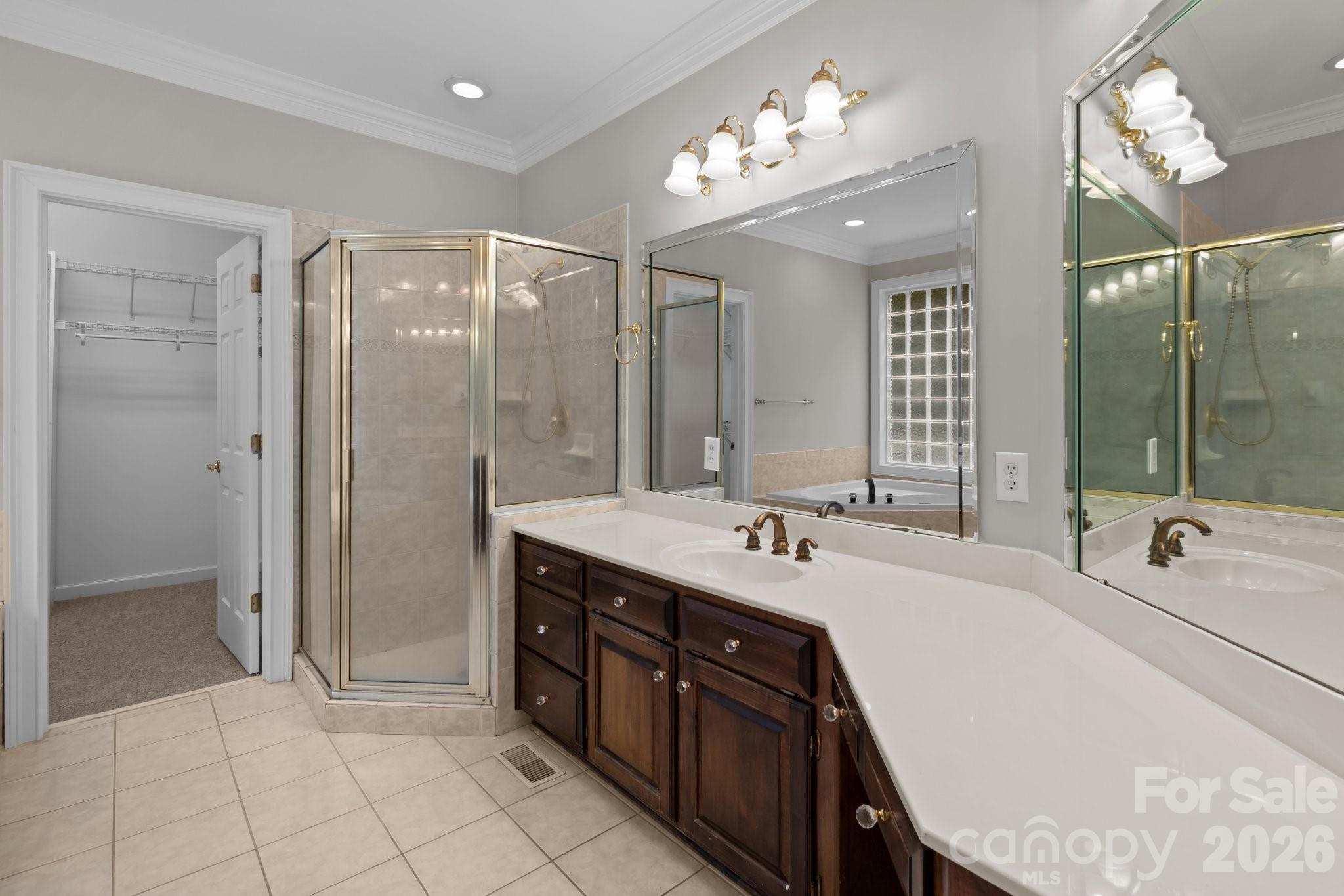 165 Futrell Landing New London, NC 28127 - Photo 24 of 48 a spacious bathroom with a double vanity sink mirror and shower