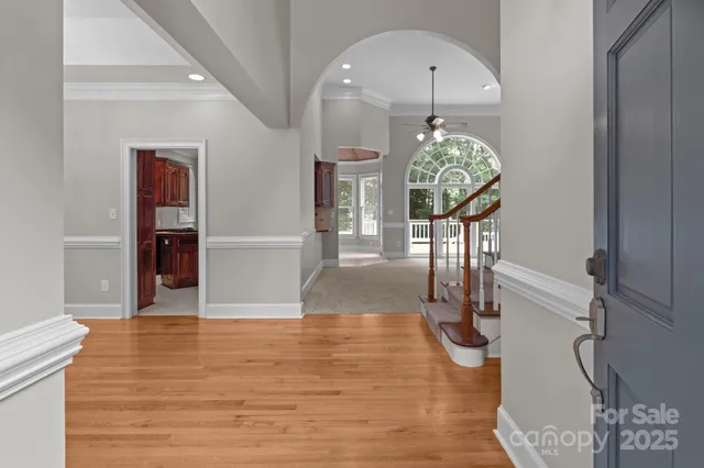a view of an entryway with wooden floor