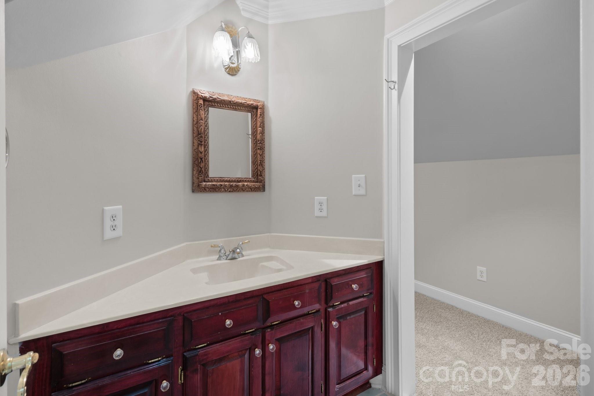 165 Futrell Landing New London, NC 28127 - Photo 34 of 48 a bathroom with a sink and two mirror