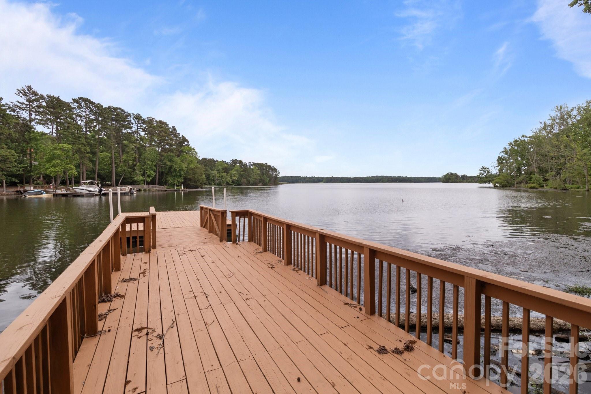 165 Futrell Landing New London, NC 28127 - Photo 41 of 48 a view of balcony and deck with wooden floor and lake view