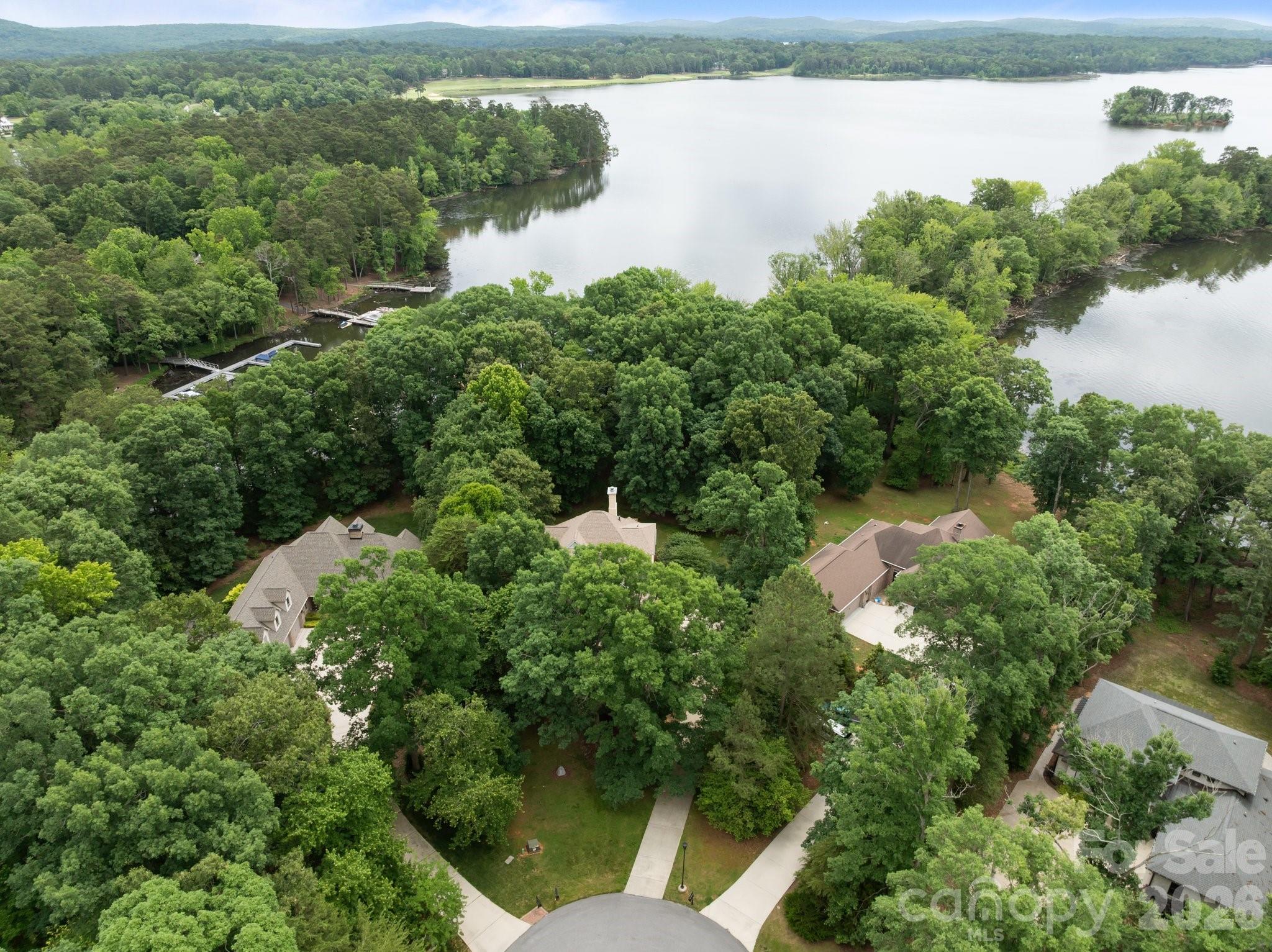 165 Futrell Landing New London, NC 28127 - Photo 47 of 48 an aerial view of lake residential house with outdoor space and trees around