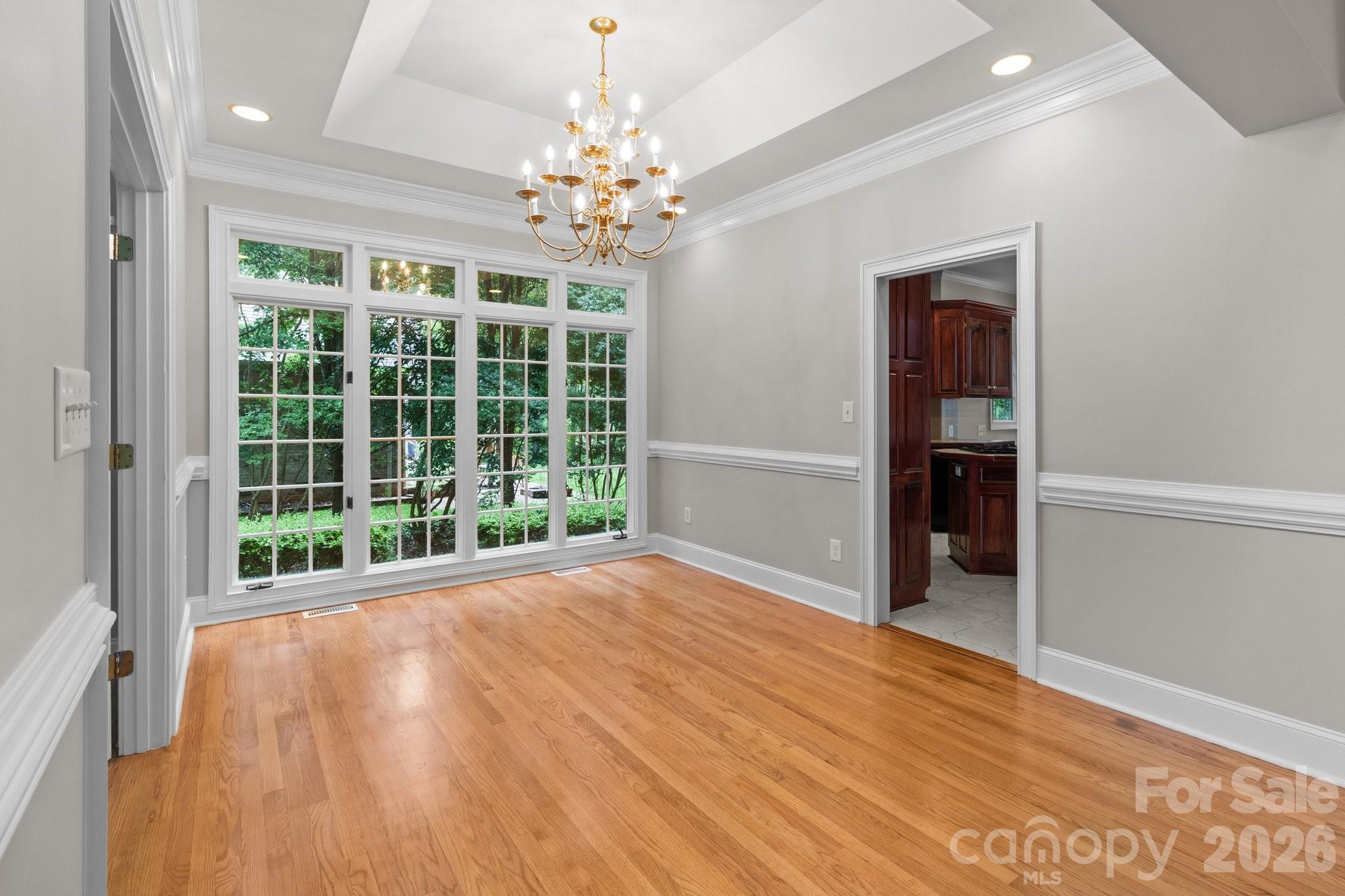 165 Futrell Landing New London, NC 28127 - Photo 6 of 48 a view of an empty room with wooden floor and a window