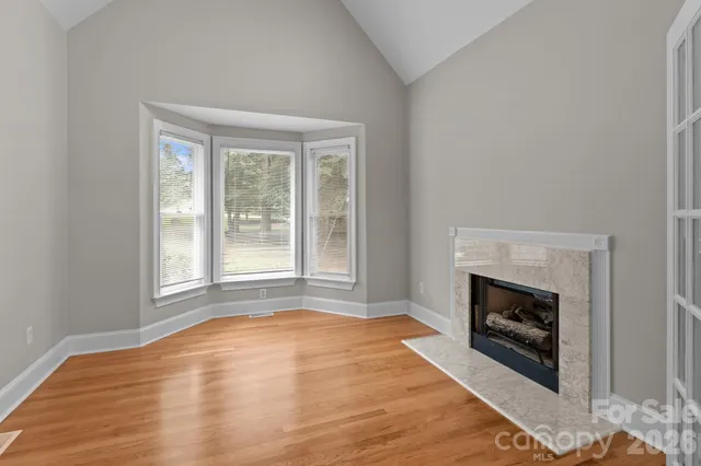 a kitchen with stainless steel appliances granite countertop a stove refrigerator and cabinets