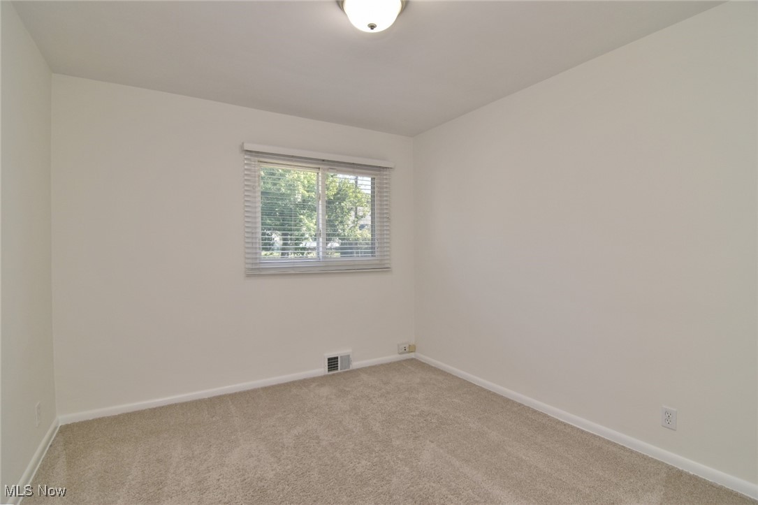 981 Hanley Road Cleveland, OH 44124 - Photo 24 of 42 Spare room featuring carpet and baseboards