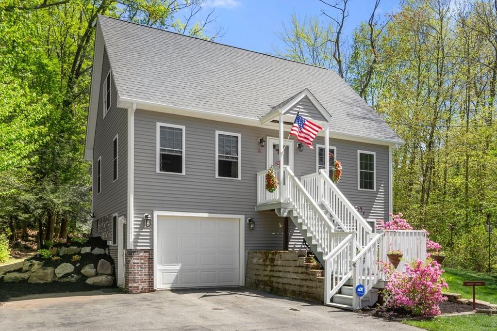 96 Sturbridge Road Holland, MA 01521 - Photo 1 of 25 a front view of house with stairs and trees