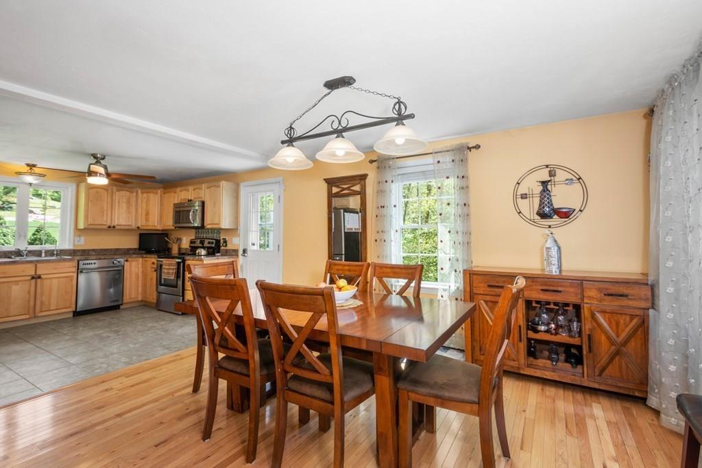 96 Sturbridge Road Holland, MA 01521 - Photo 11 of 25 a view of a dining room with furniture and wooden floor