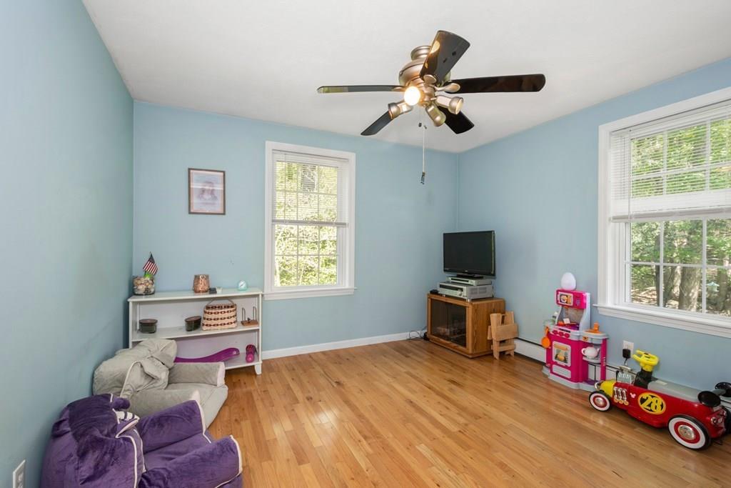 96 Sturbridge Road Holland, MA 01521 - Photo 18 of 25 a bedroom with a bed and wooden floor