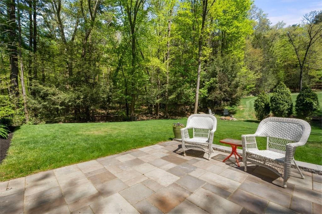 96 Sturbridge Road Holland, MA 01521 - Photo 6 of 25 a view of a chair and table in backyard of the house