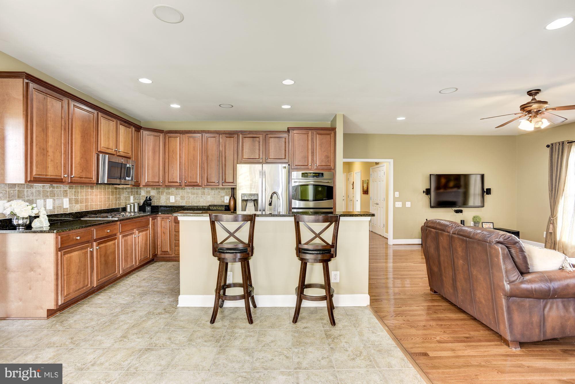 42879 Braemount Circle Ashburn, VA 20148 - Photo 11 of 53 Spacious kitchen opens to the family room