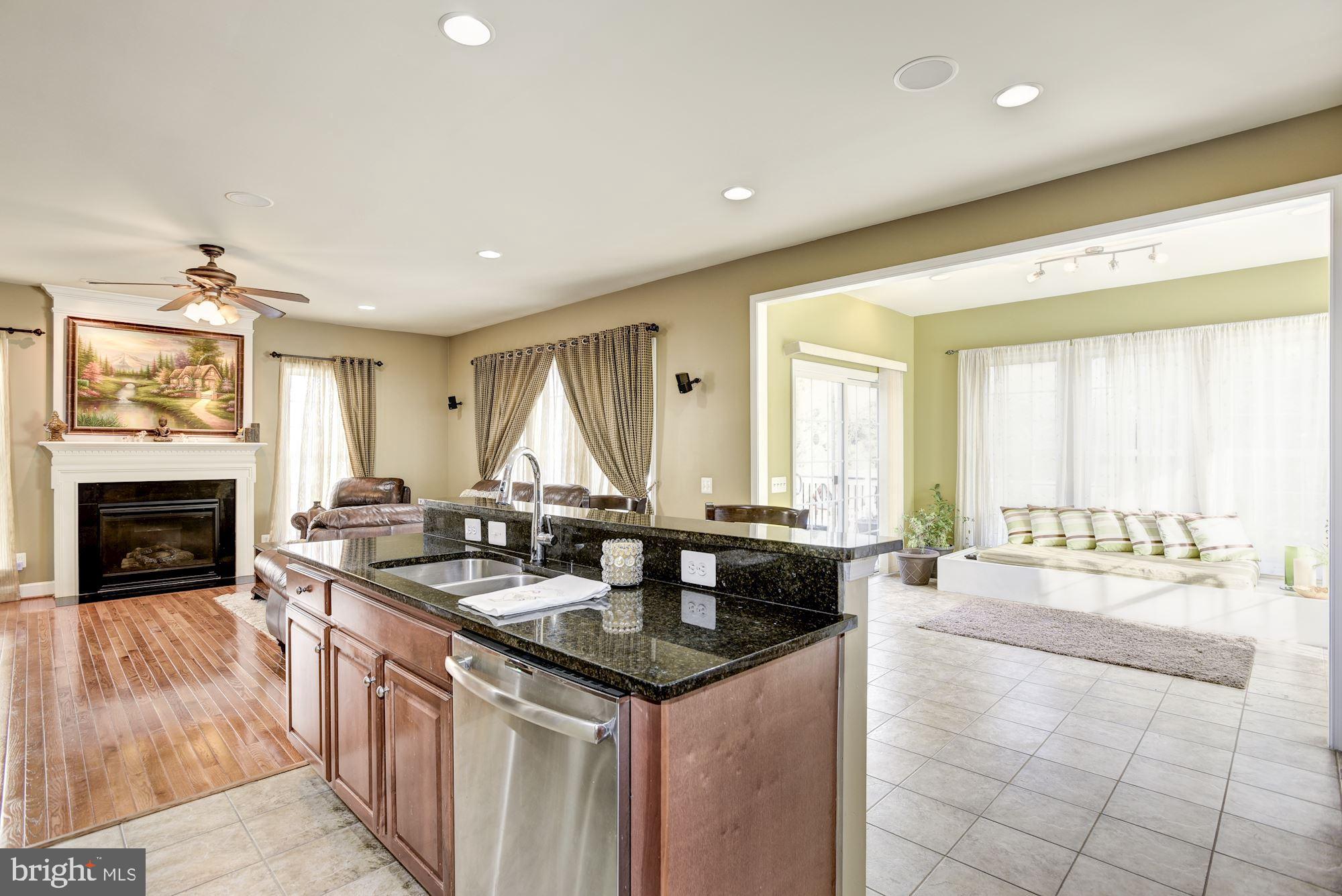 42879 Braemount Circle Ashburn, VA 20148 - Photo 13 of 53 Kitchen opens to Sunroom