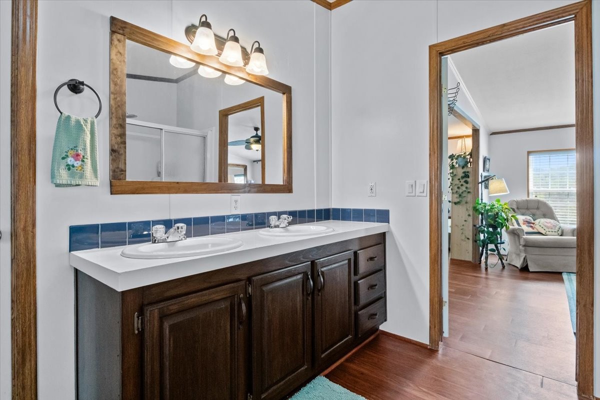 1644 West Blue Creek Road Waverly, TN 37185 - Photo 20 of 61 a bathroom with a sink and a mirror