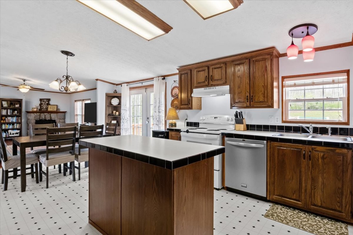 1644 West Blue Creek Road Waverly, TN 37185 - Photo 28 of 61 a kitchen with lots of counter top space and dining table