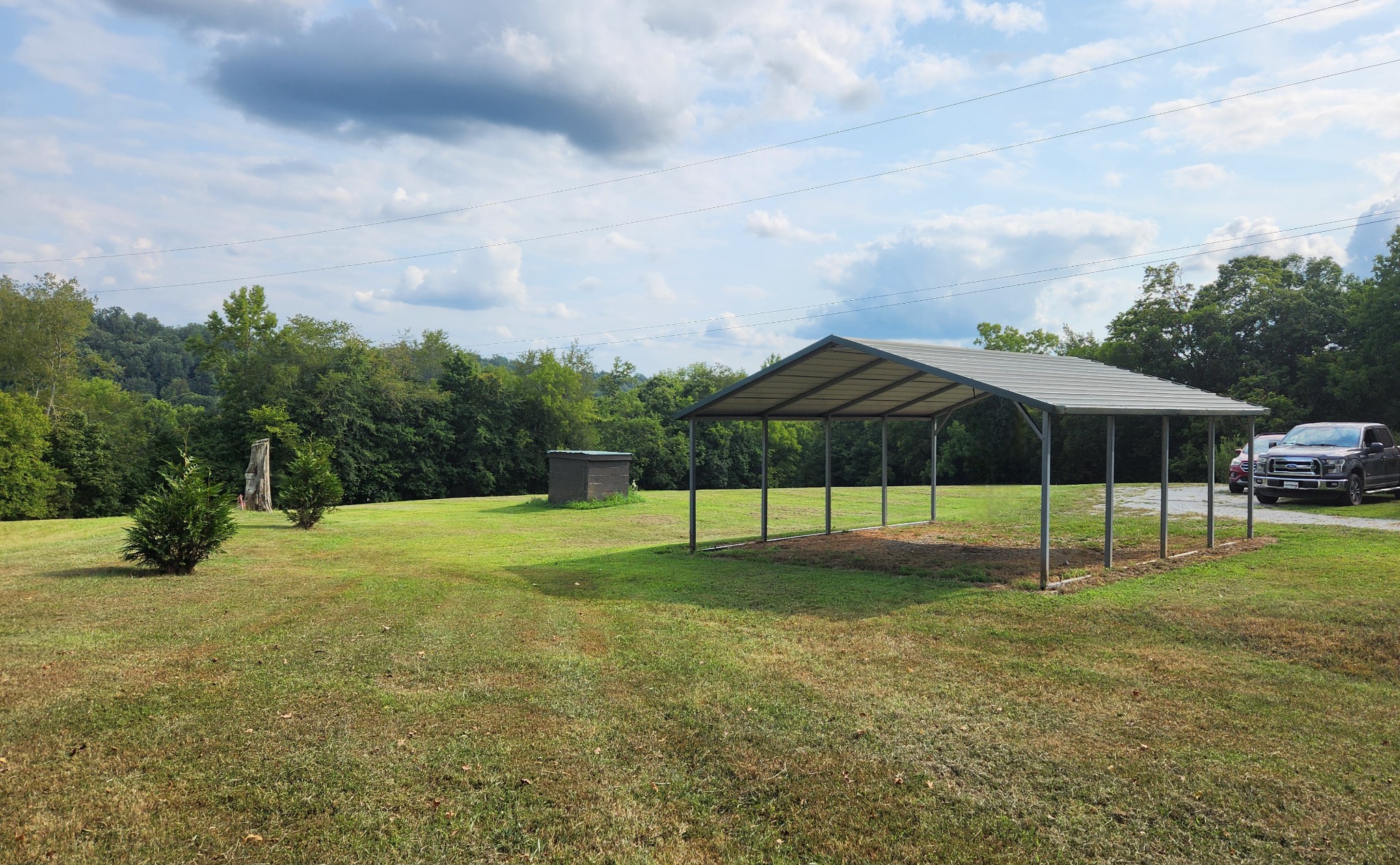 1644 West Blue Creek Road Waverly, TN 37185 - Photo 59 of 61 a view of an house with backyard and trees