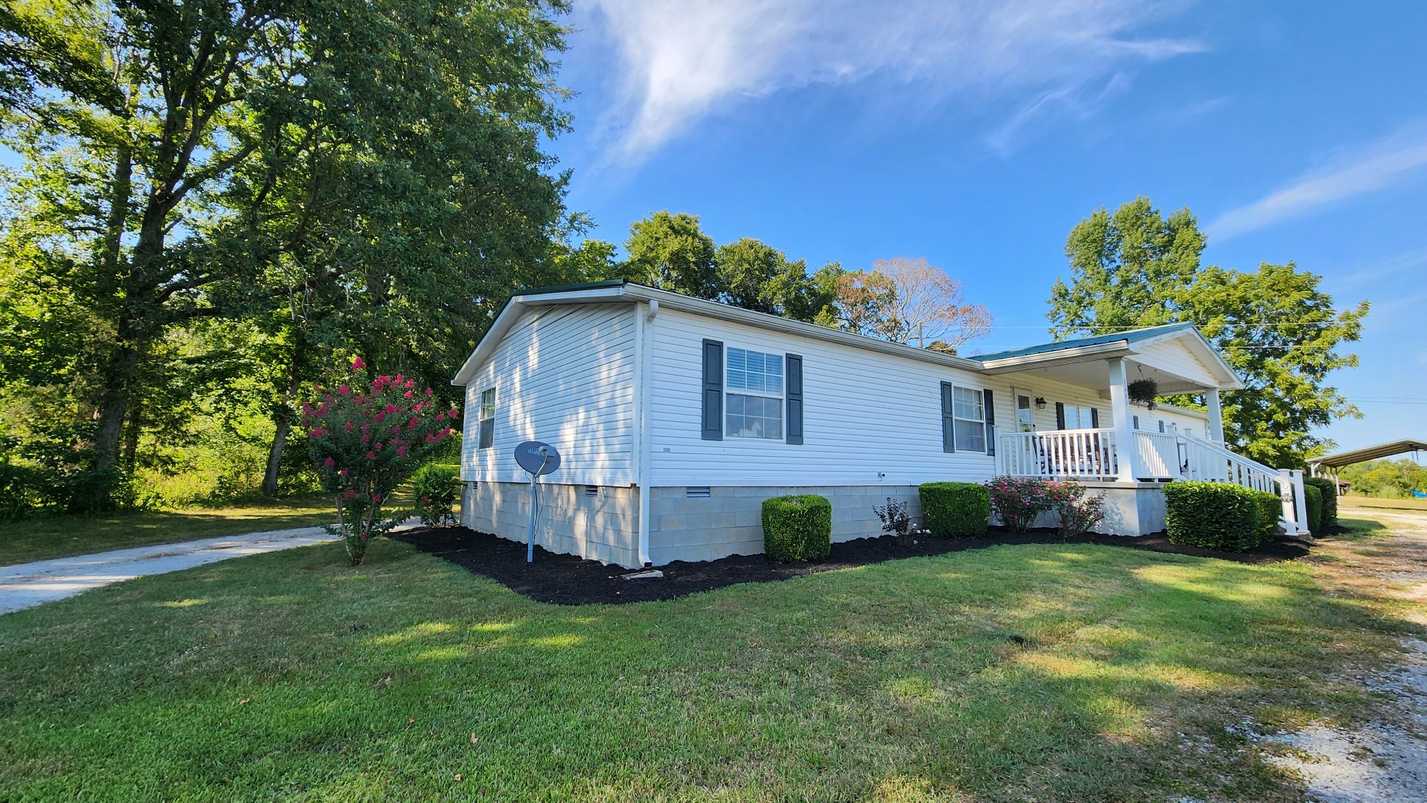 1644 West Blue Creek Road Waverly, TN 37185 - Photo 7 of 61 a view of a house with a yard