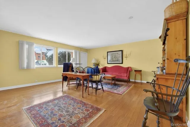 a living room with furniture and a rug