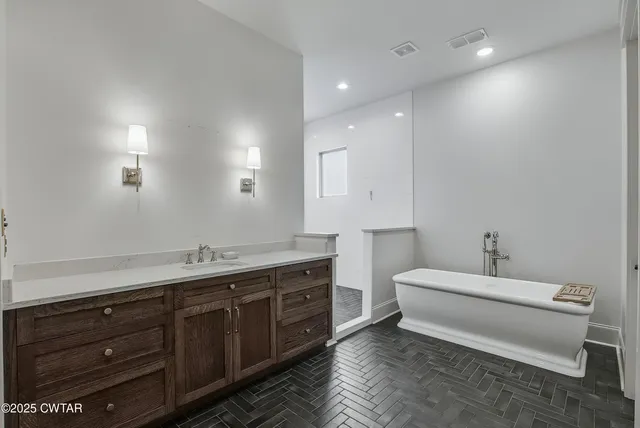 a bathroom with a double vanity sink and a mirror