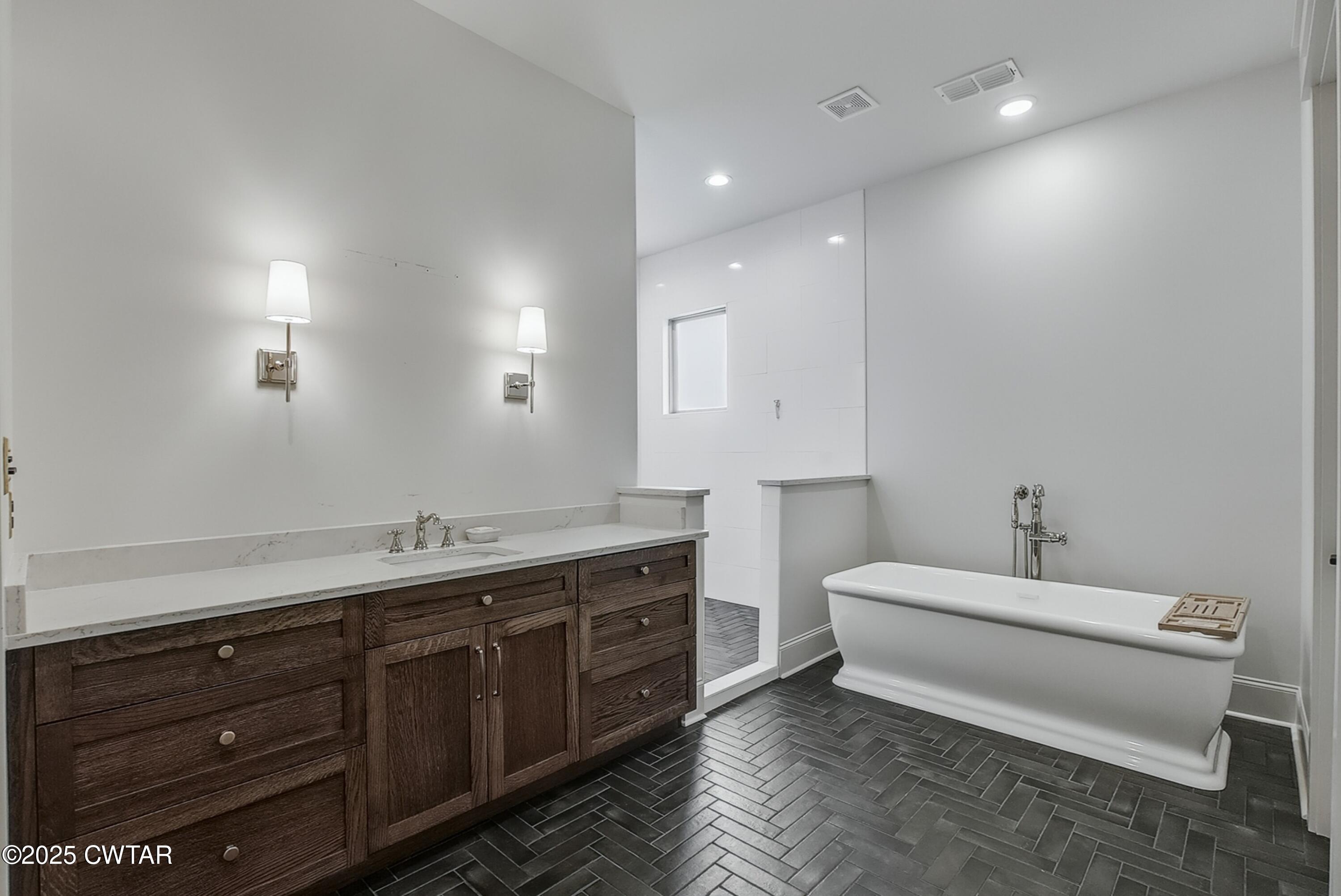 52 Buckingham Cove Jackson, TN 38305 - Photo 20 of 33 a bathroom with a double vanity sink and a mirror