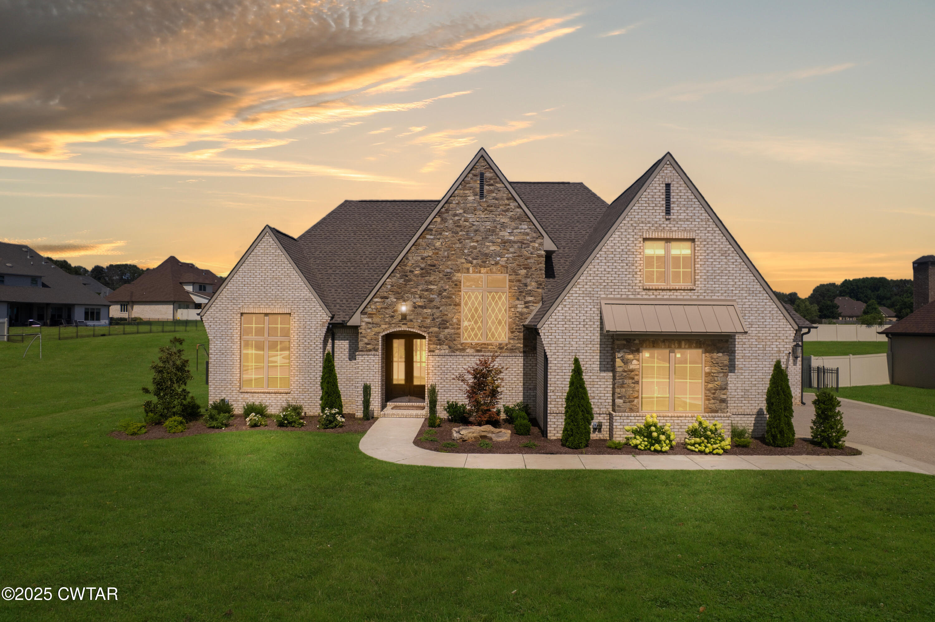 52 Buckingham Cove Jackson, TN 38305 - Photo 2 of 33 a view of a house with a yard