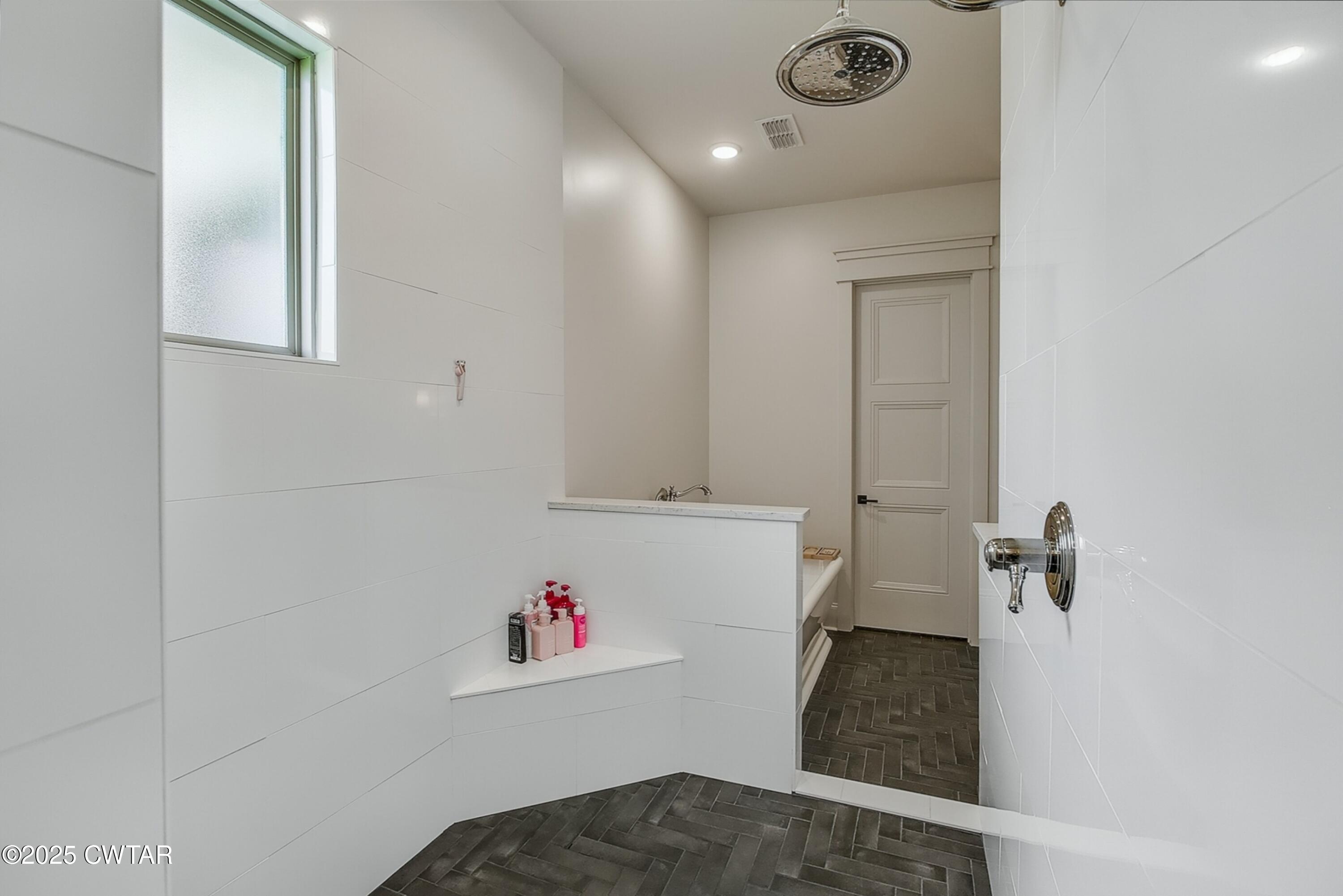 52 Buckingham Cove Jackson, TN 38305 - Photo 22 of 33 a bathroom with a tub and shower