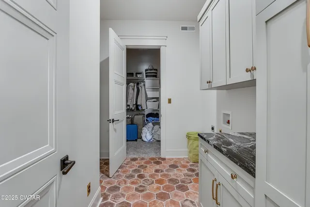 a kitchen with a refrigerator and a stove