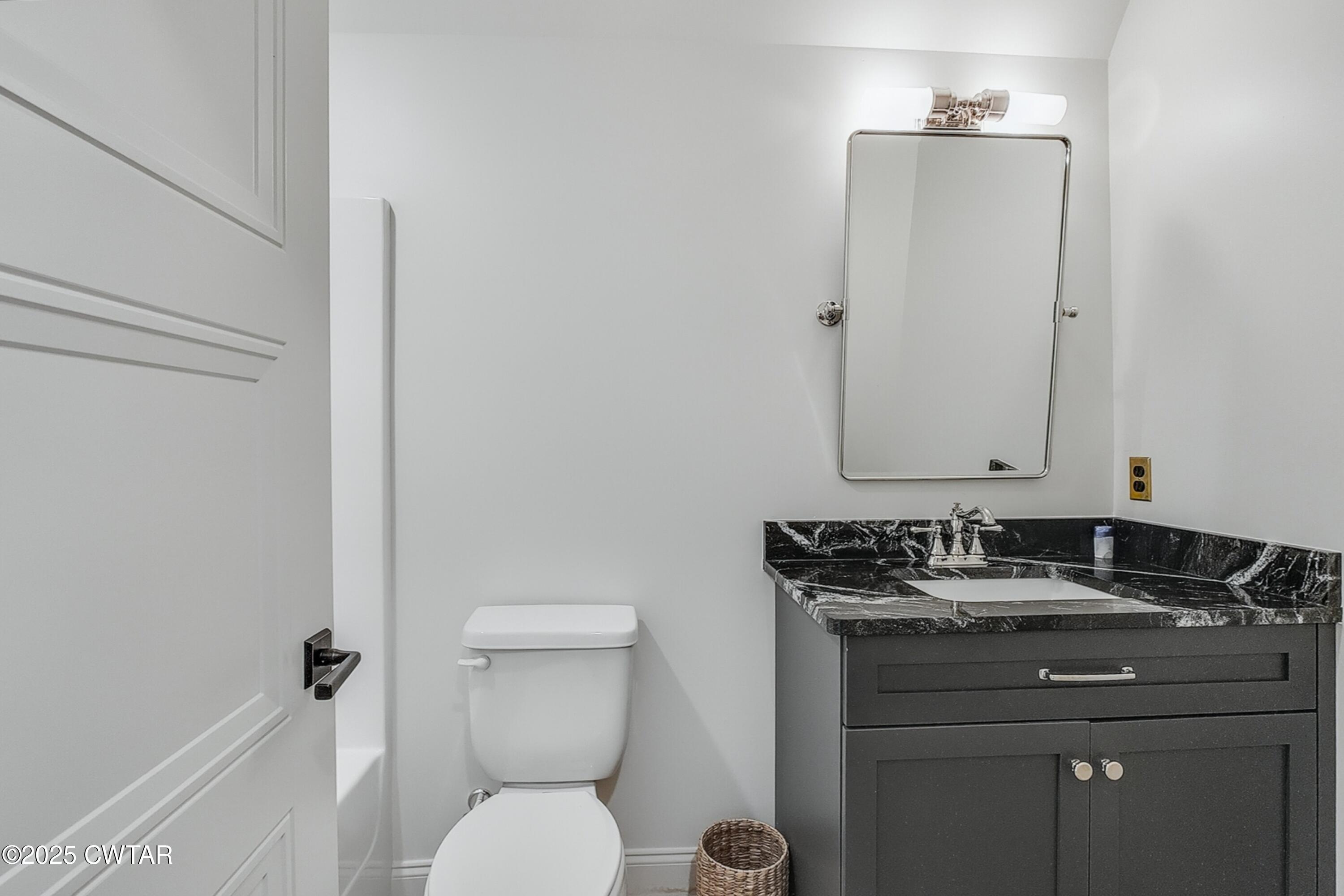 52 Buckingham Cove Jackson, TN 38305 - Photo 29 of 33 a bathroom with a sink and a toilet
