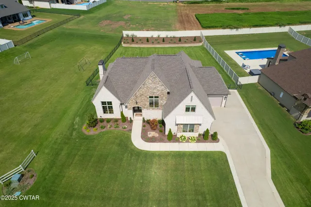 an aerial view of a house with a garden